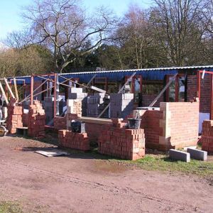 This picture were taken in March 2007 as the external brick walls and stone detailing are laid by FSMR members station build project team. At this point, the old canopy roof was still in place but was removed in May 2007 to allow the final brick courses to be built to roof height. All this cladding and roofing was renewed and profiled into the new structure as part of the project producing a weather proof covering for the platforms.